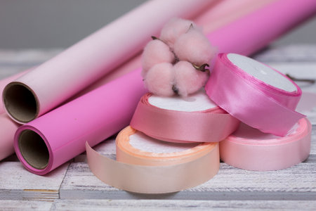 pink paper for wrapping gifts and goods.colored paper for bouquets.wrapping paper and pink ribbon for floristry.gift wrapping paperの写真素材