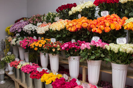 Flower shop.Multi-colored flowers vases on the showcase of the salon.Bright roses and chrysanthemums.Selling flowers.Warehouseの写真素材