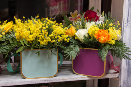 Flower arrangement for the box. Flower shop.Flowers in box on flower shop windowの写真素材