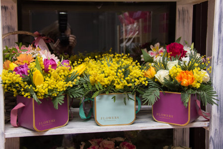 Flower arrangement for the box. Flower shop.Flowers in box on flower shop windowの写真素材