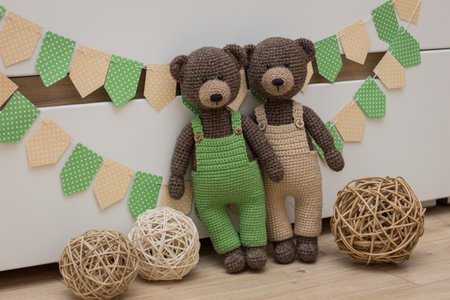 Knitted handmade toys.Crocheted yarn and wool toys.Teddy bears from yarn. Handmade toys for children.の写真素材
