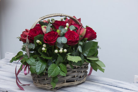 Flower arrangement in a basket.Bouquet of roses.flower shop.floristry training.floristry courses.pink roses in a basket.の写真素材