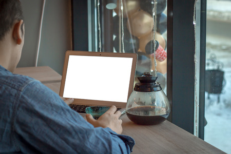 Man with coffee and white laptopの写真素材