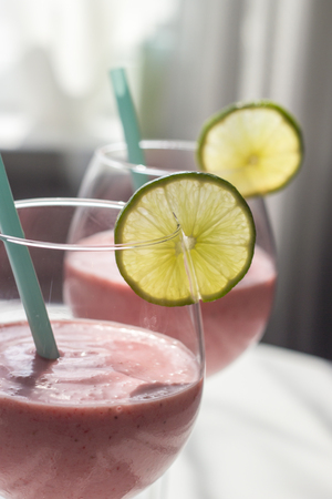 Fresh strawberry smoothie with limeの写真素材