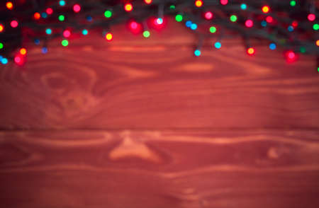 Christmas blurred background - vintage planked wood with lights and free text spaceの写真素材