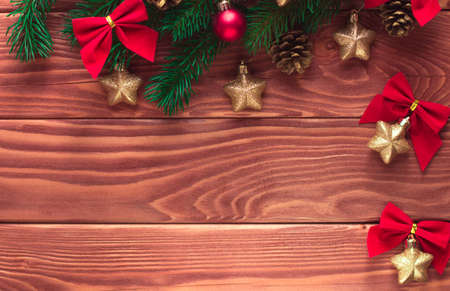 Christmas fir tree with decoration on dark wooden board. Soft focus. Happy New Year!の写真素材