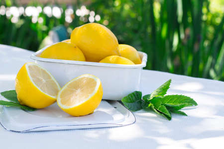 Fresh lemons on the table on natural background. Selective focus.の写真素材