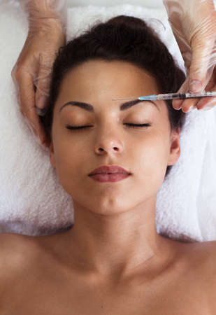 Beautiful woman gets injections. Cosmetology. Beauty Faceの写真素材