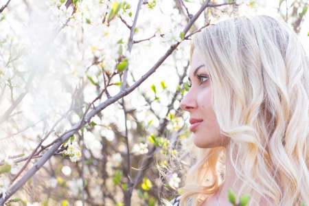 beautiful girl in the garden on a sunny dayの写真素材