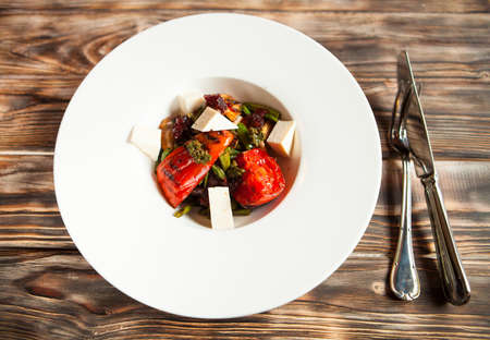 tasty tomatoes warm salad cheese and mushrooms, top viewの写真素材