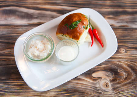 salted lard on white cutting board on wooden background. top viewの写真素材