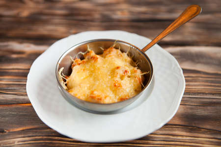Casserole with chicken and mushrooms  julienne on the table. Horizontal top viewの写真素材