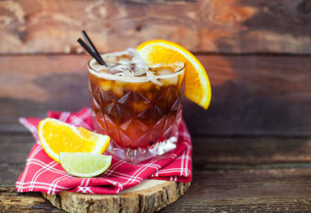 Cold Coffee with orange  On Wooden rustic backgroundの写真素材
