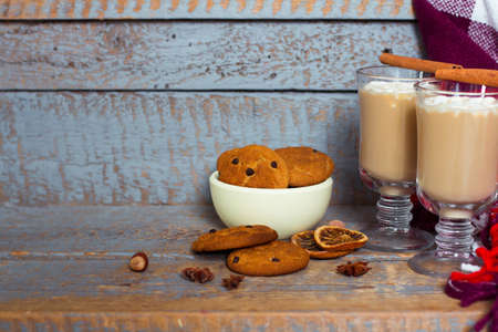 Hot cacao with marshmallows and cookies on a gray wooden backgroundの写真素材