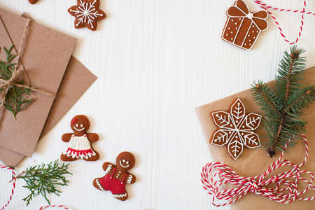 Christmas composition. Xmas cookies, Gingerbread man, ribbon, card, festive decoration, fir branches...