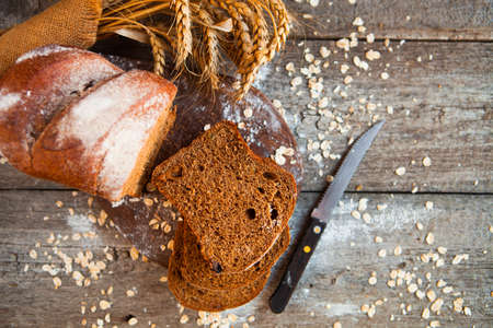 Different bread and bread slices. Food background and rustic tableの写真素材