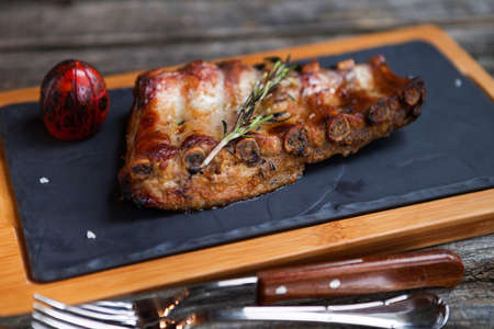 Close up Mouth Watering Juicy Grilled Pork Rib Meat on Top of Wooden Cutting Boardの写真素材