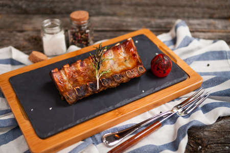Close up Mouth Watering Juicy Grilled Pork Rib Meat on Top of Wooden Cutting Boardの写真素材