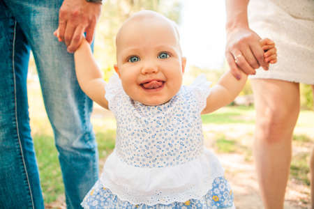 Happy young caucasian family spending time outdoor on a summer day, picnic in the park. Setの写真素材
