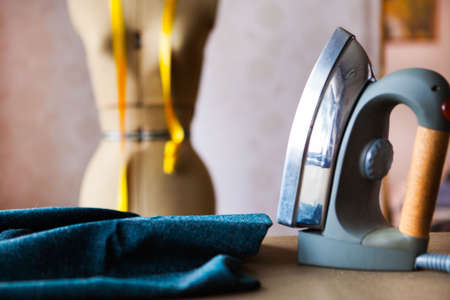 Close up of professional iron in a tailor's factory, tailoring themeの写真素材