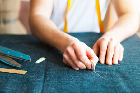 Tailor man working in his tailor shop, Tailoring, close upの写真素材