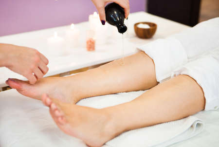 Beautiful young woman relaxing with hand massage at beauty spa salon. Close-up, Spa treatment. Ð¡oncept of healthの写真素材