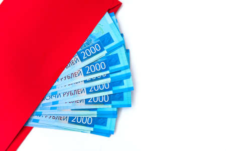 Russian money banknotes currency rouble on white isolated background. in nominal value of two thousand. New tickets bank Russia. Close up. Rich conceptの写真素材