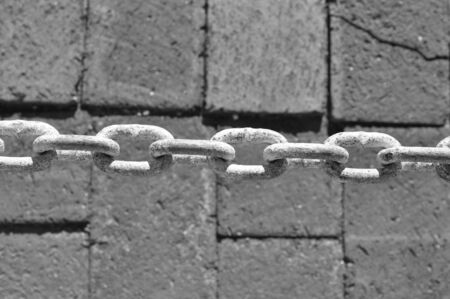 Black and white photo of a chain links closeupの写真素材