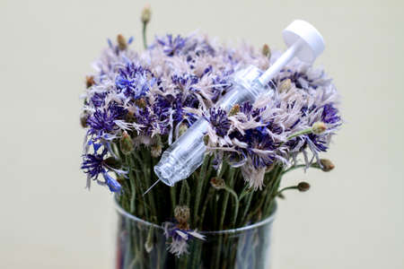 syringe in flowers. Cosmetological procedures. Injections, injections. Diseases, treatment,...