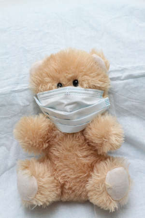 plush toy with a syringe mask. vaccination, covid, virus, epidemic, pandemic.