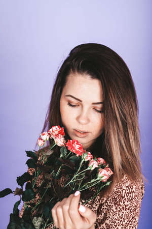 sweet, tender. sexy woman with roses on a light backgroundの写真素材