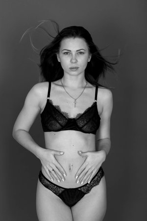 young woman in beautiful lace lingerie. developing hairの写真素材