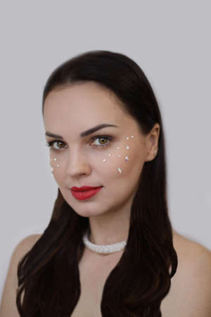 gentle portrait of a woman with bare collarbones. strict facial features, tenderness and hardiness.の写真素材