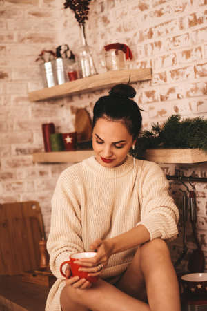 cheerful, happy girl in the New Years kitchen. preparation for the holiday of the new year.