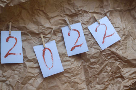 numbers 2022 are drawn in brown paint. two thousand twenty-second year, new year. Flat lay Top viewの写真素材