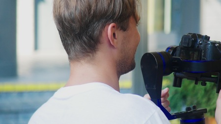 Operator with Steadicam recording video. professional photo video equipmentの写真素材