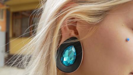 bodymification. close-up of a young beautiful woman with tunnels in her ears. copy spaceの写真素材