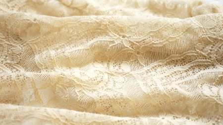 fabric background. beige lace pattern. texture, close-upの写真素材