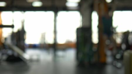 Blur background. barbells in the gym. Blurred fitness room with weight training barの写真素材