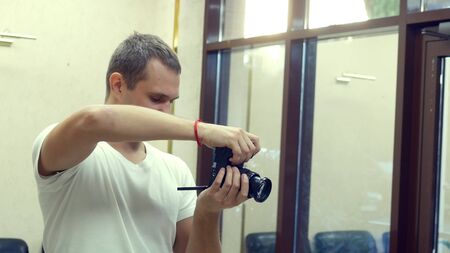 male professional photographer emotionally communicates with a model and takes a photo,の写真素材