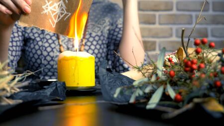 runic magic. master burns runic spell on parchmentの写真素材