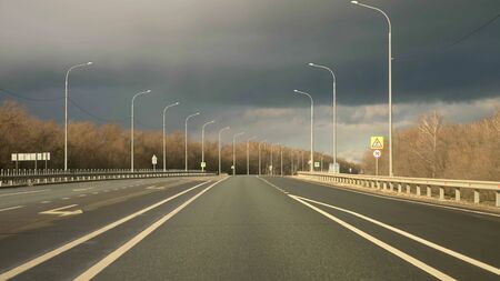 highway with road markings and lights in the countrysideの写真素材