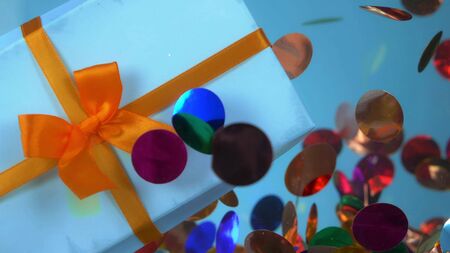 closeup. gift box and confetti under water. fashion design background.の写真素材