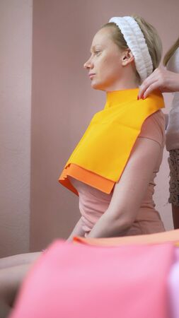 vertically. the stylist conducts a color type procedure for a womanの写真素材