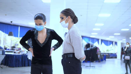 ballroom dancers wearing medical masks rehearse before the performance. covid 19の写真素材