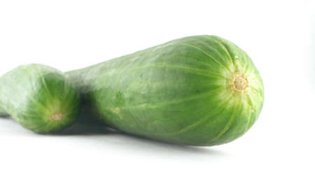 super close-up, in detail. fresh cucumber on white backgroundの写真素材