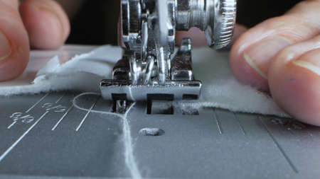 extreme close-up, detailed. iron needle of electric sewing machine