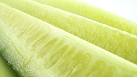 detailed. fresh cucumber sliced ââlengthwise on a white backgroundの写真素材