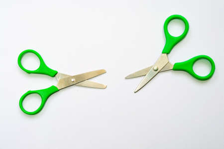 Two pairs of scissors turning their blades to each otherの写真素材