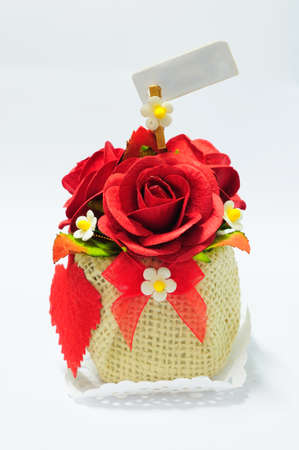 artificial rose bouquet isolated on whiteの写真素材